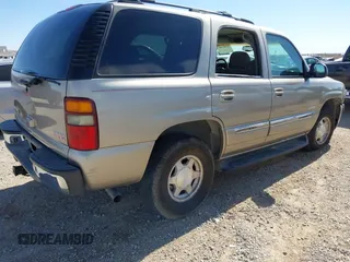 2003 GMC Yukon SLT with VIN 1GKEC13V33R298333, listed as a IAAI auction lot 41582447 with 166,047 mi miles. Bid and sale history available at carsss.com. Image 4.