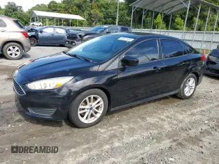 2018 Ford Focus SE z VIN 1FADP3F23JL212856, wystawiony jako Copart lot #60521635 z przebiegiem 149 017 mil mil oraz Czysty tytuł • Clean title. Historia ofert i sprzedaży dostępna na DreamBid. Obrazek 1.