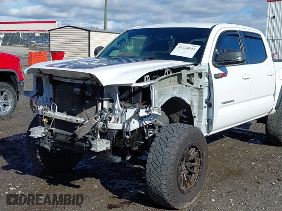 2020 Toyota Tacoma SR5 with VIN 3TMAZ5CN4LM132002, listed as a IAAI auction lot 41224844 with 55,000 mi miles and . Bid and sale history available at DreamBid. Image 6.