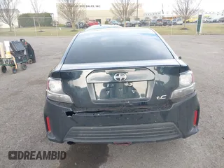2015 Scion tC with VIN JTKJF5C7XFJ001662, listed as a IAAI auction lot 41843123 with 128,851 mi miles. Bid and sale history available at carsss.com. Image 16.