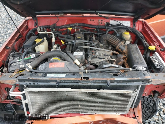 1999 Jeep Cherokee Sport with VIN 1J4FF68S7XL560943, listed as a Copart auction lot 58425505 with 68,654 mi miles and Salvage title. Bid and sale history available at DreamBid. Image 12.