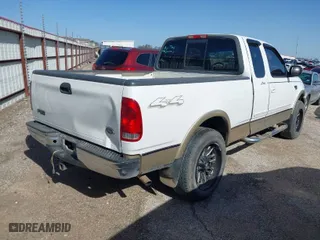 2000 Ford F-150 XL with VIN 1FTRX18W6YNA72319, listed as a IAAI auction lot 41682748 with 265,559 mi miles. Bid and sale history available at carsss.com. Image 4.