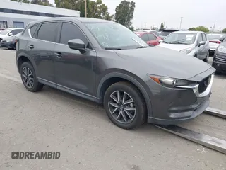 2018 Mazda CX-5 Touring z VIN JM3KFACMXJ1408052, wystawiony jako IAAI lot #42042289 z przebiegiem 82 817 mil mil oraz . Historia ofert i sprzedaży dostępna na DreamBid. Obrazek 1.