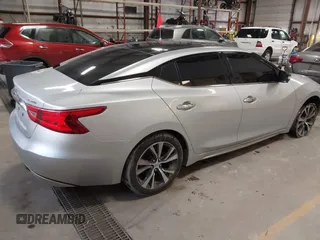 2016 Nissan Maxima SL with VIN 1N4AA6AP6GC384851, listed as a IAAI auction lot 41663659 with 127,247 mi miles and . Bid and sale history available at DreamBid. Image 4.