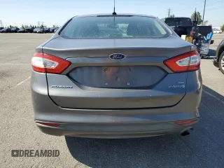 2013 Ford Fusion SE Hybrid z VIN 3FA6P0LU0DR274279, wystawiony jako Copart lot #57462315 z przebiegiem 272 825 mil mil oraz Szkoda całkowita • Salvage title. Historia ofert i sprzedaży dostępna na DreamBid. Obrazek 6.
