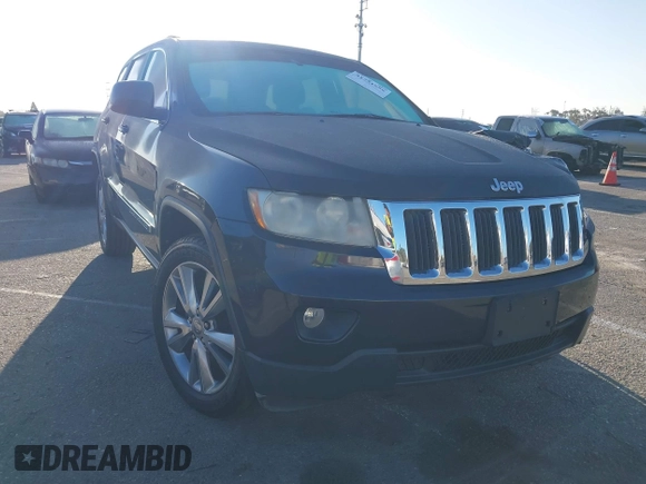 2013 Jeep Grand Cherokee Laredo with VIN 1C4RJEAG2DC643290, listed as a IAAI auction lot 41751696 with 125,258 mi miles. Bid and sale history available at carsss.com. Image 1.