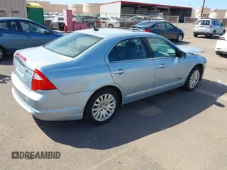2010 Ford Fusion Hybrid z VIN 3FADP0L3XAR138980, wystawiony jako IAAI lot #41545161 z przebiegiem 92 386 mil mil oraz . Historia ofert i sprzedaży dostępna na DreamBid. Obrazek 4.