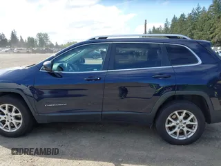 2015 Jeep Cherokee Latitude with VIN 1C4PJMCB0FW702535, listed as a IAAI auction lot 42149898 with 125,938 mi miles and . Bid and sale history available at carsss.com. Image 14.