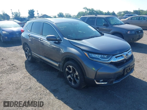 2018 Honda CR-V Touring z VIN 5J6RW2H93JL004834, wystawiony jako IAAI lot #42351364 z przebiegiem 63 746 mil mil oraz . Historia ofert i sprzedaży dostępna na DreamBid. Obrazek 1.
