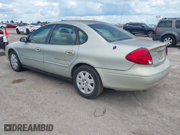 2003 Ford Taurus LX Standard z VIN 1FAFP52U43A149177, wystawiony jako IAAI lot #42227480 z przebiegiem 140 379 mil mil oraz . Historia ofert i sprzedaży dostępna na DreamBid. Obrazek 3.