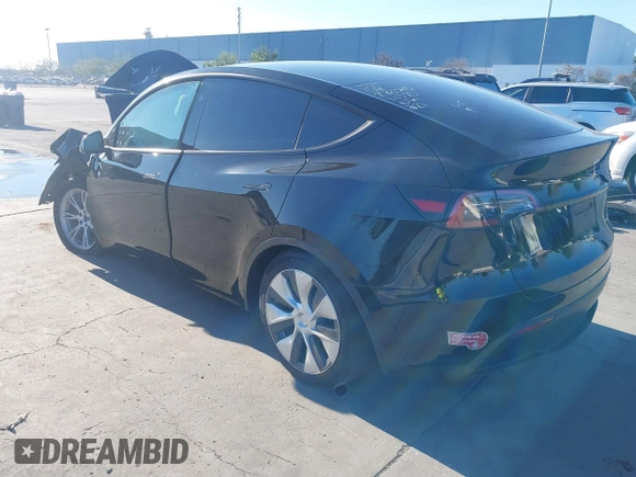 2024 Tesla Model Y Long Range with VIN 7SAYGAEE7RF014424, listed as a IAAI auction lot 41402098 with 6,052 mi miles and . Bid and sale history available at DreamBid. Image 3.