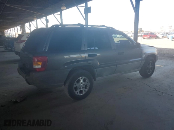2000 Jeep Grand Cherokee Laredo with VIN 1J4GW48S0YC253091, listed as a Copart auction lot 60357255 with 218,410 mi miles and Clean title. Bid and sale history available at DreamBid. Image 3.