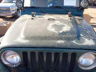 2000 Jeep Wrangler Sahara with VIN 1J4FA59S2YP734290, listed as a IAAI auction lot 41874866 with 201,036 mi miles. Bid and sale history available at carsss.com. Image 6.