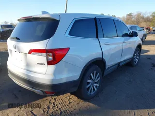 2022 Honda Pilot EX-L with VIN 5FNYF6H54NB084899, listed as a IAAI auction lot 41524725 with 35,827 mi miles and . Bid and sale history available at DreamBid. Image 4.
