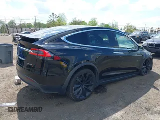 2019 Tesla Model X 75D with VIN 5YJXCBE21KF180203, listed as a IAAI auction lot 42190255 with 114,294 mi miles and . Bid and sale history available at carsss.com. Image 4.