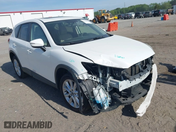 2015 Mazda CX-5 Grand Touring with VIN JM3KE2DY5F0498718, listed as a IAAI auction lot 42070000 with 129,327 mi miles. Bid and sale history available at carsss.com. Image 1.