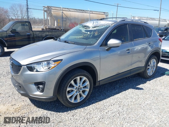 2014 Mazda CX-5 Grand Touring with VIN JM3KE4DY3E0368169, listed as a IAAI auction lot 41857976 with 127,853 mi miles. Bid and sale history available at carsss.com. Image 2.