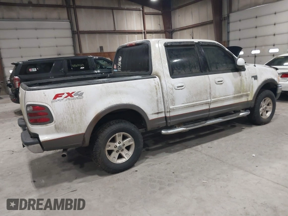 2002 Ford F-150 XLT with VIN 1FTRW08L02KE16948, listed as a IAAI auction lot 41881612 with 168,471 mi miles. Bid and sale history available at carsss.com. Image 4.