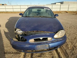 1996 Mercury Sable GS z VIN 1MELM50U3TA659219, wystawiony jako Copart lot #74373944 z przebiegiem 156 398 mil mil oraz Szkody całkowita. Historia ofert i sprzedaży dostępna na DreamBid. Obrazek 5.
