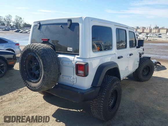 2023 Jeep Wrangler Willys with VIN 1C4HJXDG0PW638871, listed as a IAAI auction lot 42700599 with 16,171 mi miles and . Bid and sale history available at DreamBid. Image 4.