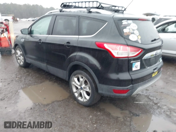 2015 Ford Escape Titanium with VIN 1FMCU0J97FUB45709, listed as a IAAI auction lot 41561636 with 88,296 mi miles. Bid and sale history available at carsss.com. Image 3.
