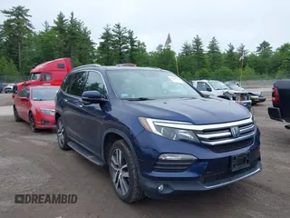 2017 Honda Pilot Touring with VIN 5FNYF6H99HB093136, listed as a IAAI auction lot 42507326 with 125,579 mi miles and . Bid and sale history available at DreamBid. Image 1.