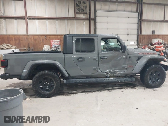 2021 Jeep Gladiator Mojave z VIN 1C6JJTEG5ML524829, wystawiony jako IAAI lot #42247982 z przebiegiem 20 158 mil mil oraz . Historia ofert i sprzedaży dostępna na DreamBid. Obrazek 13.