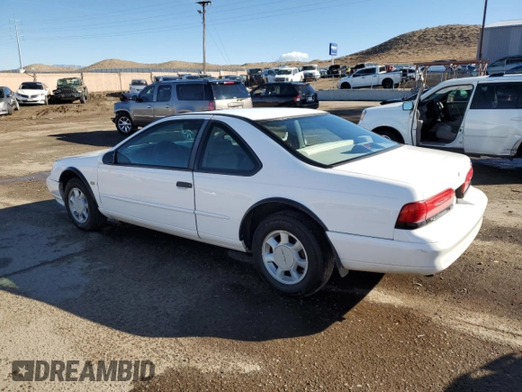 1994 Ford Thunderbird LX with VIN 1FALP62WXRH217279, listed as a Copart auction lot 80512504 with 176,798 mi miles and Salvage Title. Bid and sale history available at DreamBid. Image 2.