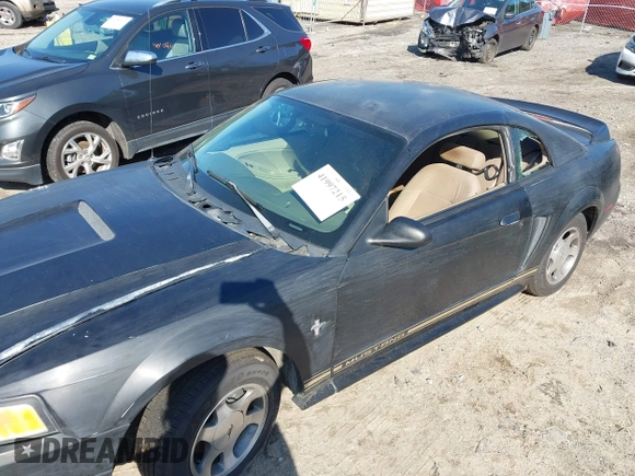 2000 Ford Mustang z VIN 1FAFP404XYF217165, wystawiony jako IAAI lot #41997215 z przebiegiem Nie podano mil oraz . Historia ofert i sprzedaży dostępna na DreamBid. Obrazek 6.