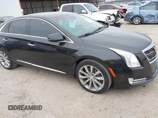 2017 Cadillac XTS Luxury with VIN 2G61M5S39H9166549, listed as a IAAI auction lot 41593859 with 164,557 mi miles. Bid and sale history available at carsss.com. Image 1.