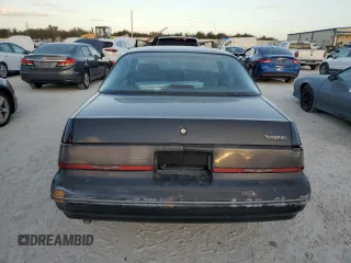 1988 Ford Thunderbird with VIN 1FABP60F9JH246775, listed as a Copart auction lot 77428264 with Not Provided miles and Salvage Title. Bid and sale history available at DreamBid. Image 6.