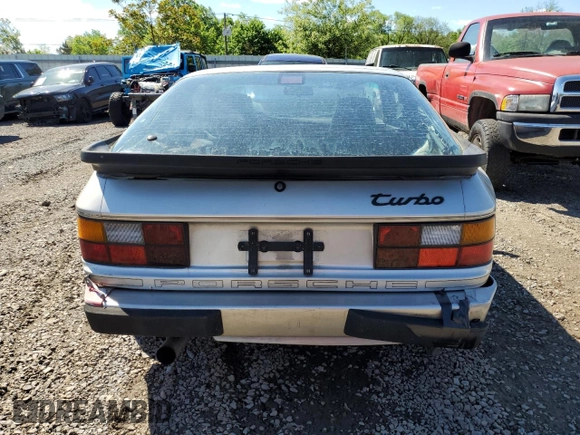 1986 Porsche 944 z VIN WP0AA0954GN155776, wystawiony jako Copart lot #56032785 z przebiegiem 17 696 mil mil oraz Szkoda całkowita • Salvage title. Historia ofert i sprzedaży dostępna na DreamBid. Obrazek 6.