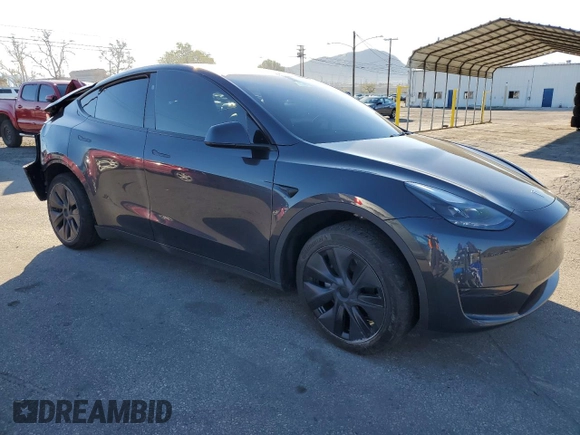 2024 Tesla Model Y with VIN 7SAYGDED7RF108604, listed as a Copart auction lot 48384825 with 24,603 mi miles and Salvage Title. Bid and sale history available at DreamBid. Image 4.