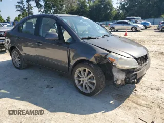 2011 Suzuki SX4 LE with VIN JS2YC5A27B6304410, listed as a Copart auction lot 72119824 with 118,357 mi miles and Salvage Title. Bid and sale history available at carsss.com. Image 4.
