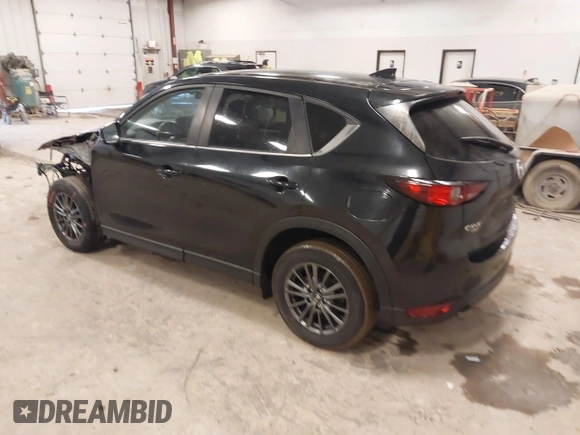 2021 Mazda CX-5 Touring with VIN JM3KFBCM1M1380409, listed as a IAAI auction lot 41677537 with 55,319 mi miles. Bid and sale history available at carsss.com. Image 3.