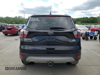 2017 Ford Escape SE z VIN 1FMCU0G93HUF10560, wystawiony jako Copart lot #57973915 z przebiegiem 127 444 mil mil oraz Czysty tytuł • Clean title. Historia ofert i sprzedaży dostępna na DreamBid. Obrazek 6.