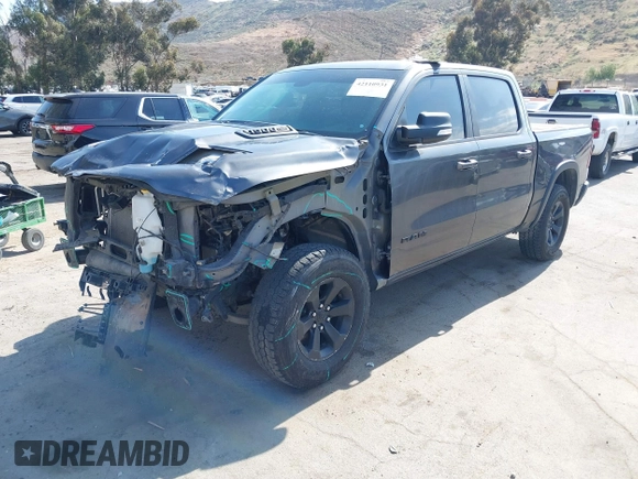2019 Ram 1500 Rebel z VIN 1C6SRFLT2KN696557, wystawiony jako IAAI lot #42110931 z przebiegiem 81 372 mil mil oraz . Historia ofert i sprzedaży dostępna na DreamBid. Obrazek 20.