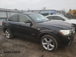 2015 BMW X4 xDrive28i with VIN 5UXXW3C55F0M88228, listed as a Copart auction lot 82940173 with 73,519 mi miles. Bid and sale history available at carsss.com. Image 4.