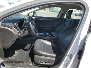 2013 Ford Fusion SE Hybrid z VIN 3FA6P0LU6DR325719, wystawiony jako Copart lot #55777715 z przebiegiem 152 478 mil mil oraz Szkoda całkowita • Salvage title. Historia ofert i sprzedaży dostępna na DreamBid. Obrazek 7.