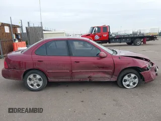 2005 Nissan Sentra S z VIN 3N1CB51D65L479897, wystawiony jako IAAI lot #41469212 z przebiegiem 152 995 mil mil oraz . Historia ofert i sprzedaży dostępna na DreamBid. Obrazek 13.