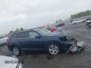 2022 Volkswagen Atlas SE z VIN 1V2HR2CA0NC561411, wystawiony jako IAAI lot #41941719 z przebiegiem Nie podano mil oraz . Historia ofert i sprzedaży dostępna na DreamBid. Obrazek 13.