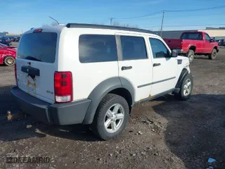 2007 Dodge Nitro SXT with VIN 1D8GU28K07W712036, listed as a IAAI auction lot 41982161 with 164,759 mi miles. Bid and sale history available at carsss.com. Image 4.