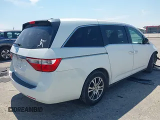 2012 Honda Odyssey EX-L with VIN 5FNRL5H61CB019215, listed as a IAAI auction lot 41837320 with 248,498 mi miles and . Bid and sale history available at DreamBid. Image 4.