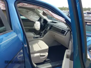 2019 Volkswagen Atlas SE z VIN 1V2WR2CA5KC524650, wystawiony jako IAAI lot #42217791 z przebiegiem 92 571 mil mil oraz . Historia ofert i sprzedaży dostępna na DreamBid. Obrazek 5.