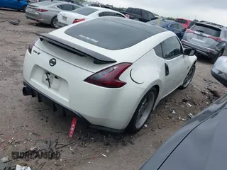 2016 Nissan 370Z Sport z VIN JN1AZ4EH1GM930883, wystawiony jako IAAI lot #41909945 z przebiegiem 80 484 mil mil oraz . Historia ofert i sprzedaży dostępna na DreamBid. Obrazek 4.