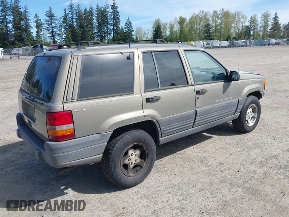 1997 Jeep Grand Cherokee Laredo with VIN 1J4GZ58S5VC500257, listed as a IAAI auction lot 41996034 with 222,513 mi miles and . Bid and sale history available at DreamBid. Image 4.
