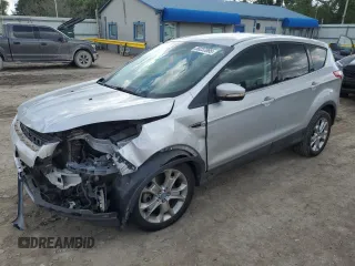 2013 Ford Escape SEL z VIN 1FMCU9HX1DUB15143, wystawiony jako Copart lot #56237095 z przebiegiem 127 017 mil mil oraz Szkoda całkowita • Salvage title. Historia ofert i sprzedaży dostępna na DreamBid. Obrazek 1.