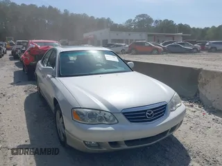 2001 Mazda Millenia with VIN JM1TA221011711379, listed as a IAAI auction lot 41897580 with 151,307 mi miles and . Bid and sale history available at DreamBid. Image 1.