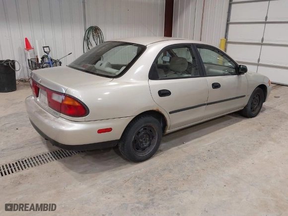 1997 Mazda Protege DX with VIN JM1BC141XV0113096, listed as a IAAI auction lot 41834308 with NaN miles. Bid and sale history available at carsss.com. Image 4.