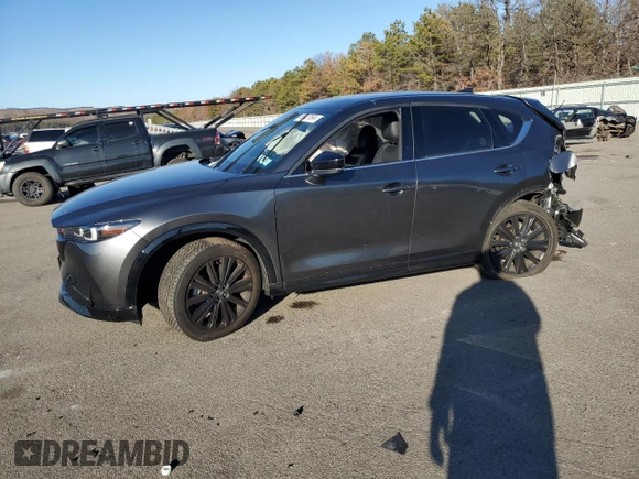 2022 Mazda CX-5 2.5 Turbo with VIN JM3KFBAY2N0596945, listed as a Copart auction lot 86427694 with Not Provided miles and Salvage Title. Bid and sale history available at carsss.com. Image 1.